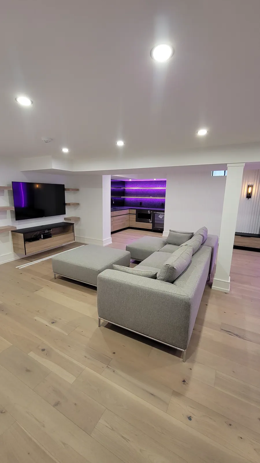 Finished residential interior with recessed lighting.